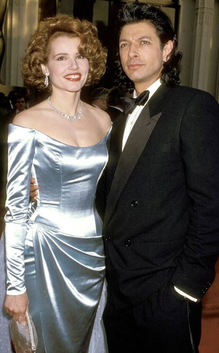 Jeff Goldblum in a black tux poses a picture with actress Geena Davis.